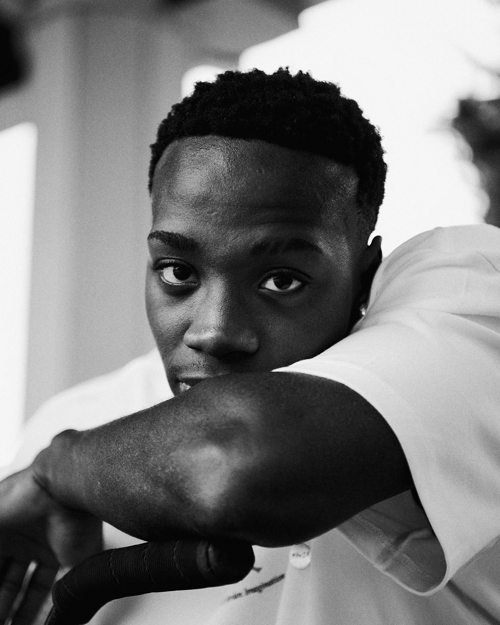 Person resting arm on bicycle handlebar