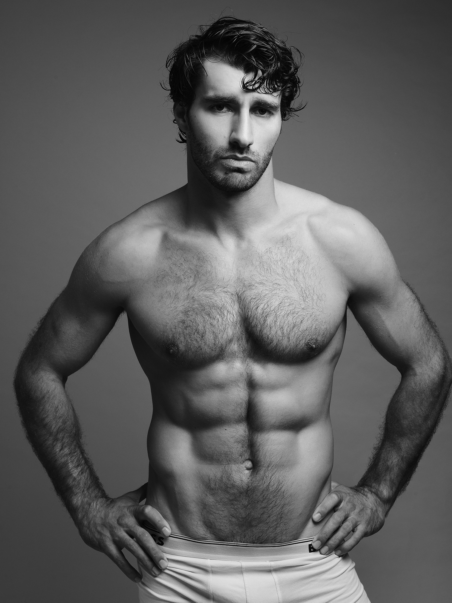 Black and white photo of a muscular man.