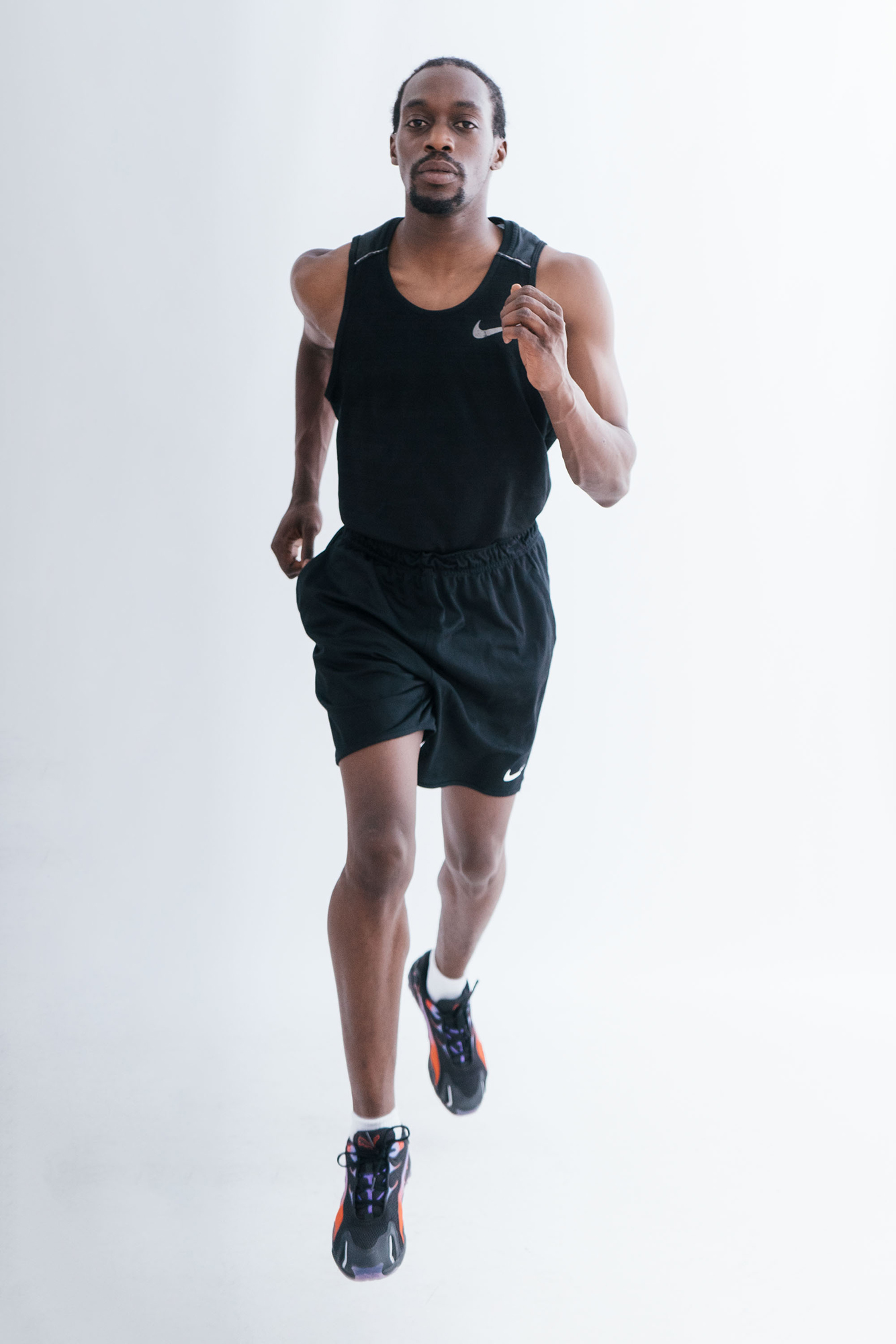 Man jogging in athletic wear.