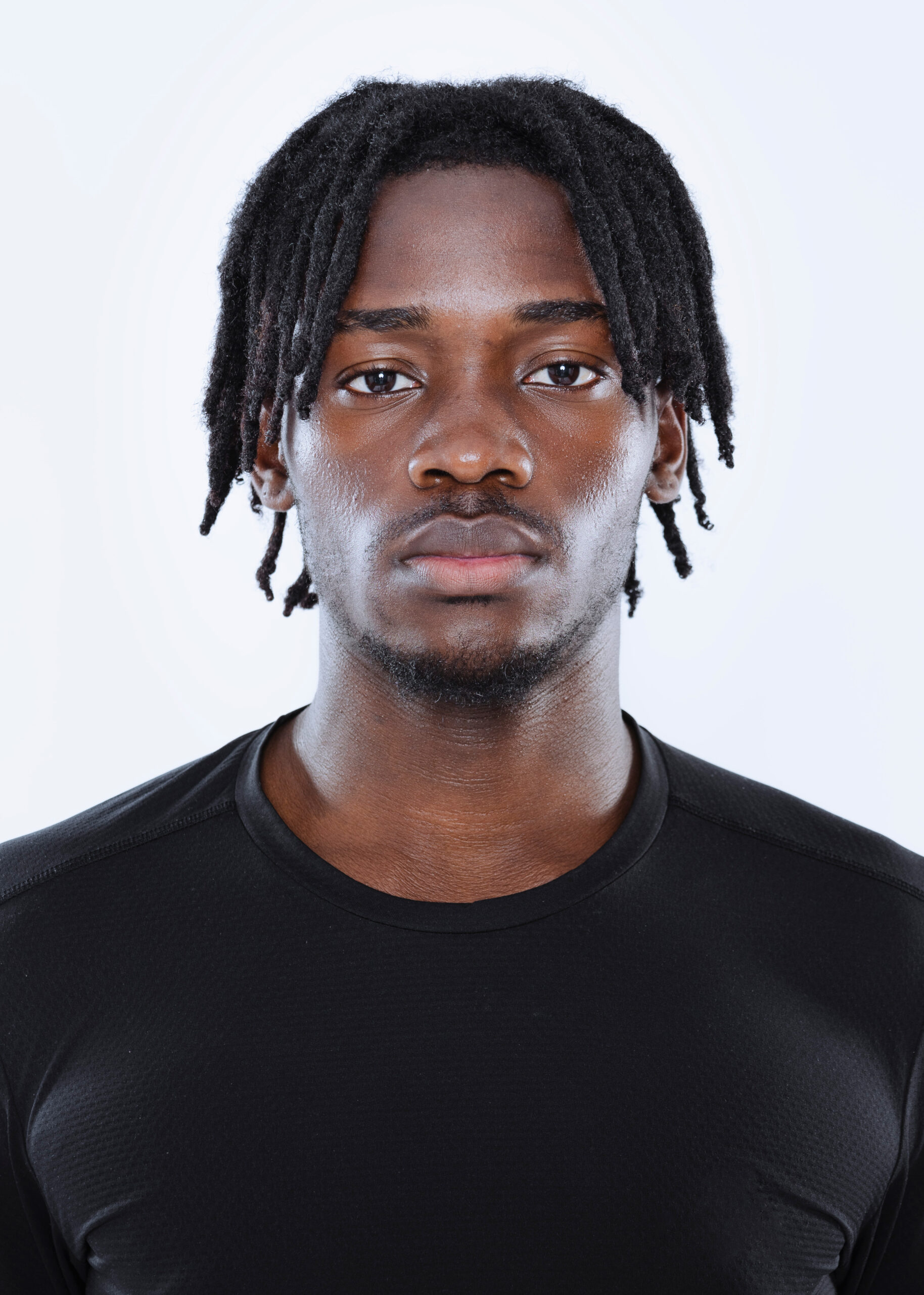 Person wearing black shirt with neutral expression