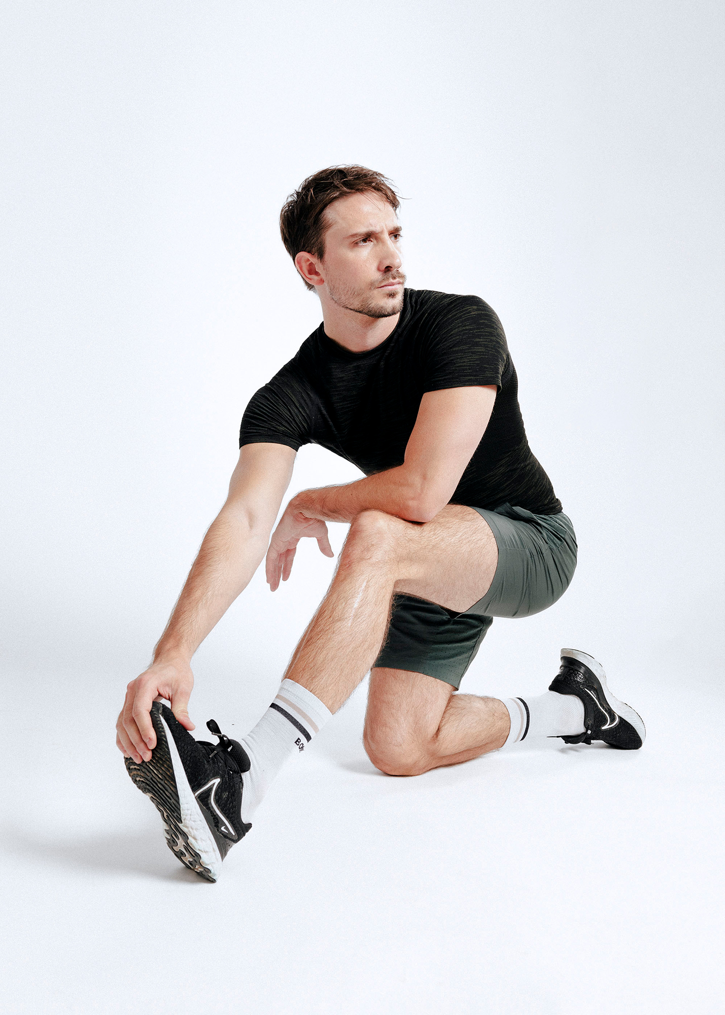 Man stretching in athletic outfit