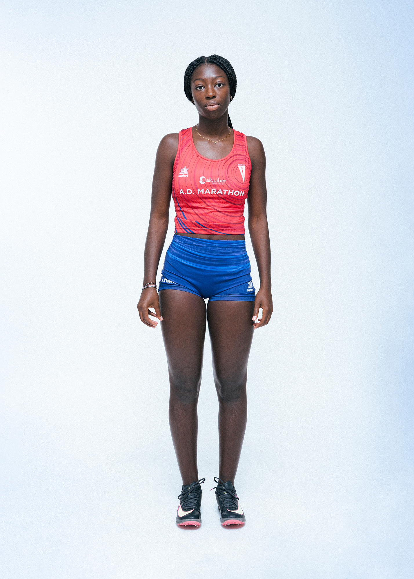 Athlete in red and blue running attire