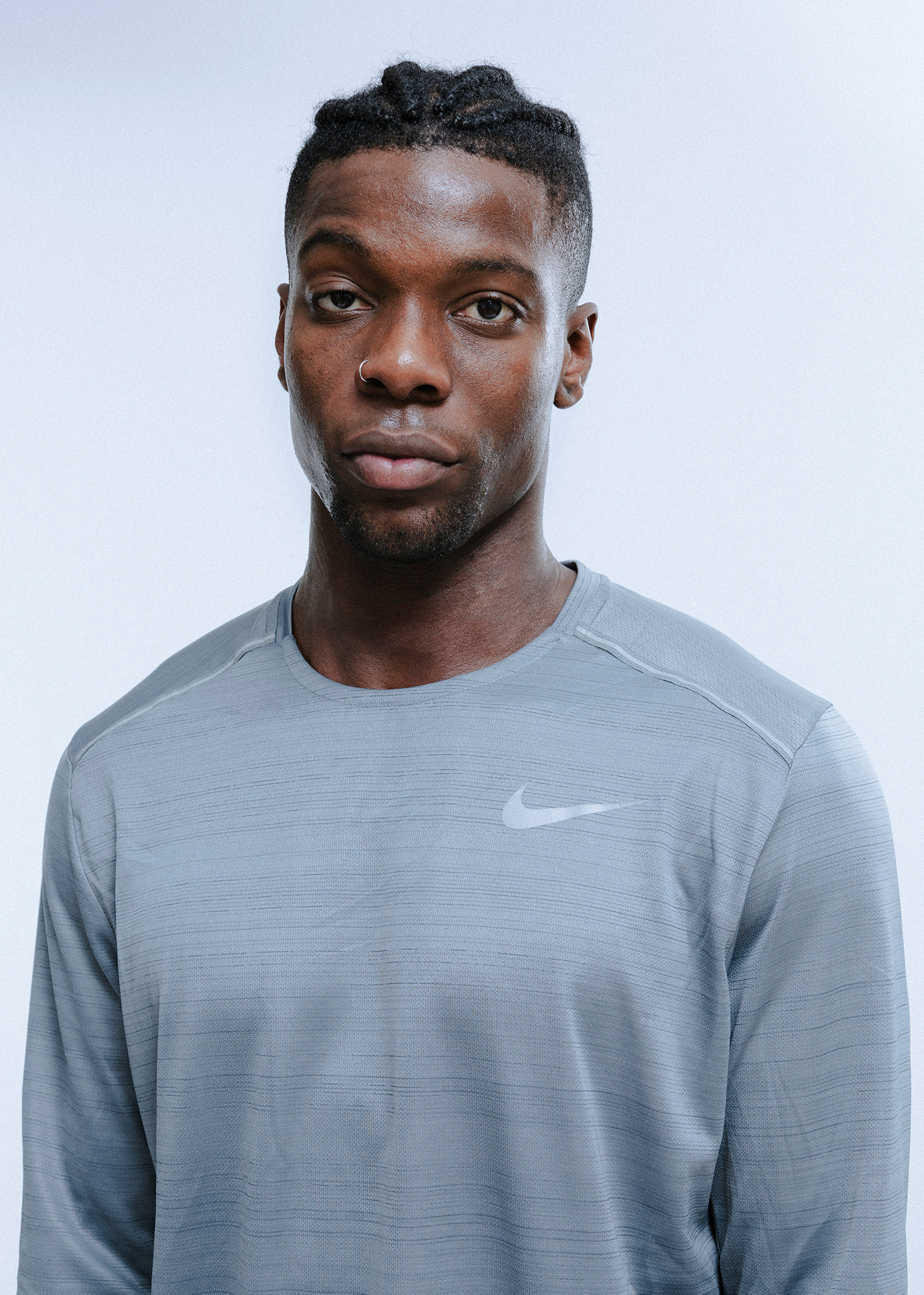 Person wearing gray Nike athletic shirt