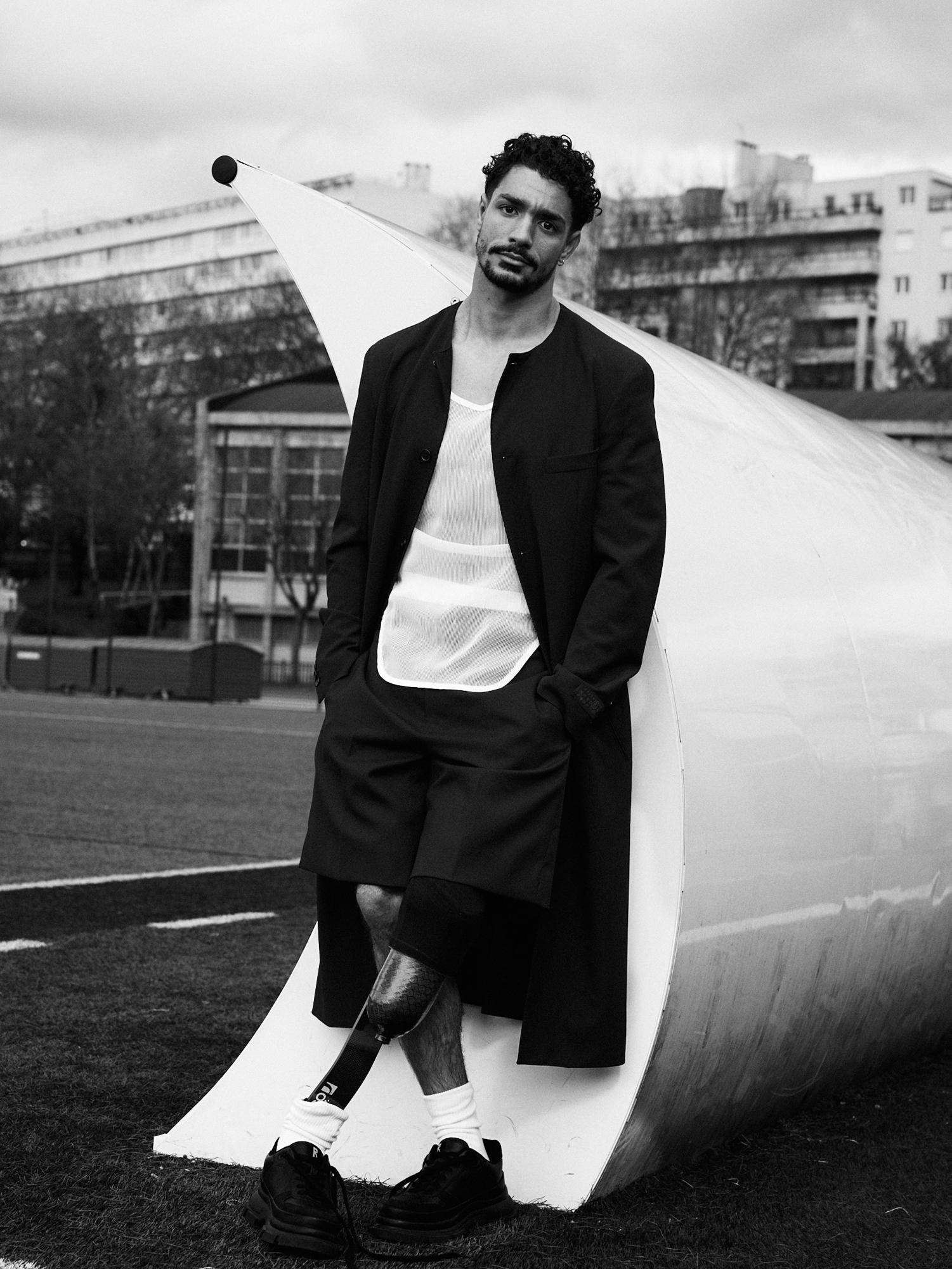 Man in stylish outfit standing outdoors