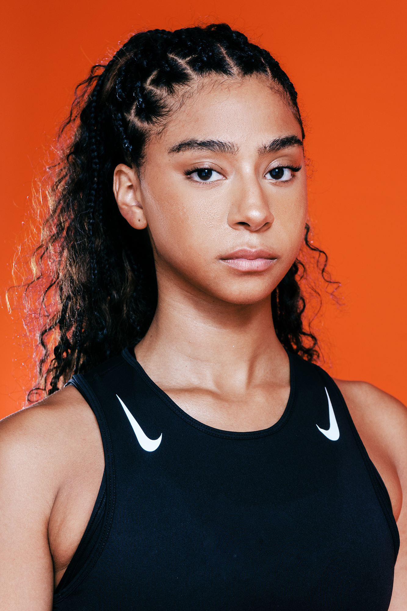 Woman in sportswear, orange background