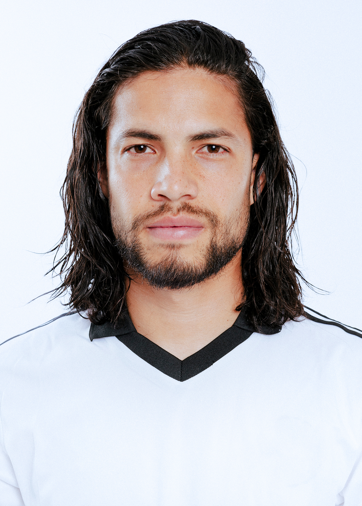 Person wearing white shirt, looking forward.